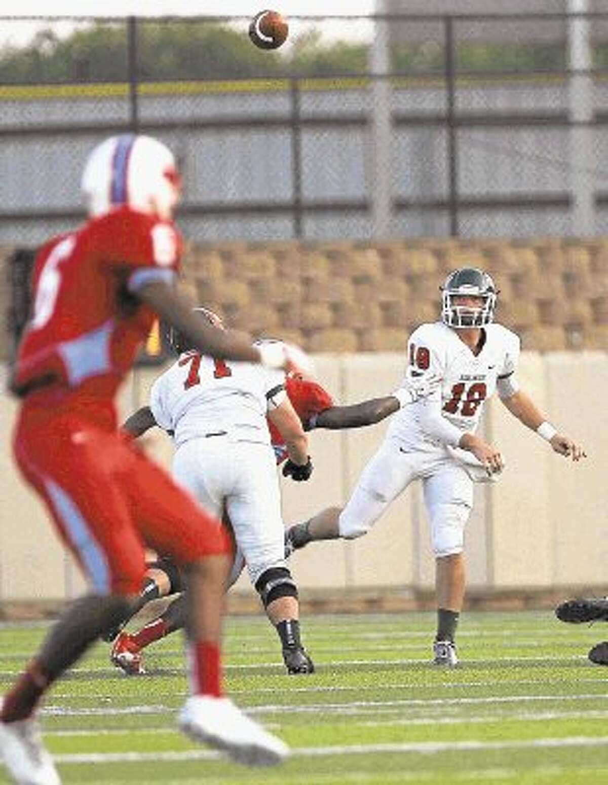 The Woodlands quarterback Chris Andritsos passes against Dallas Skyline. Andritsos is The Courier’s Player of the Week after helping the Highlanders shut out Hightower 17-0.