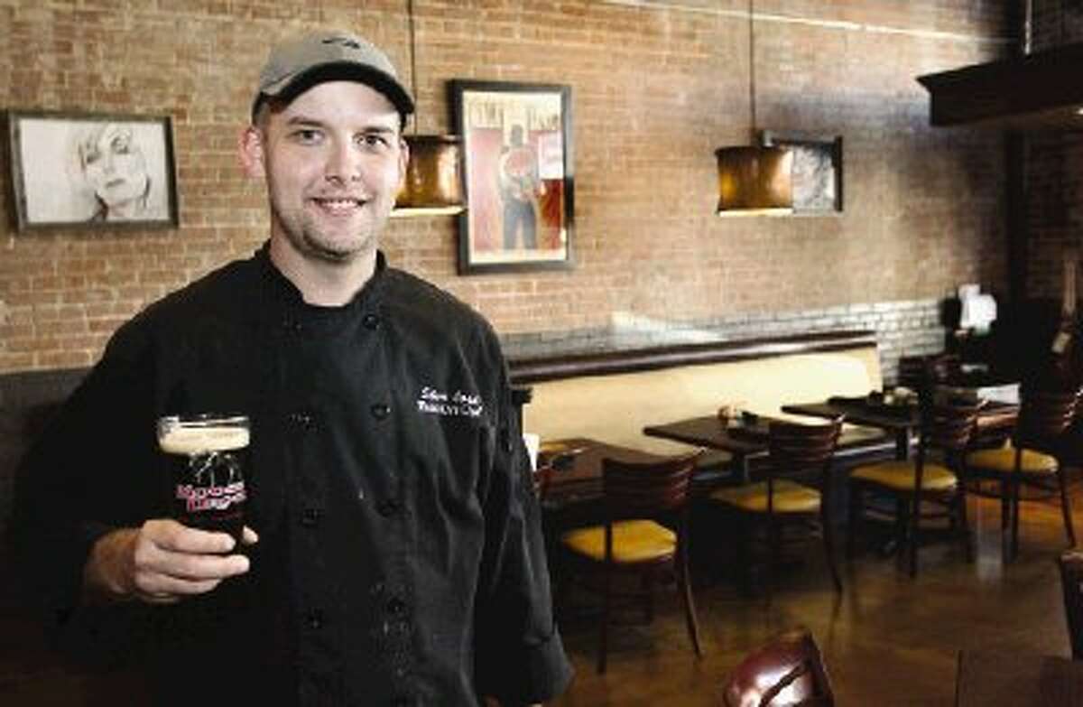 Red Brick Tavern executive chef Steve Cook enjoys one of the restaurant’s craft brews between the lunch and dinner shift.