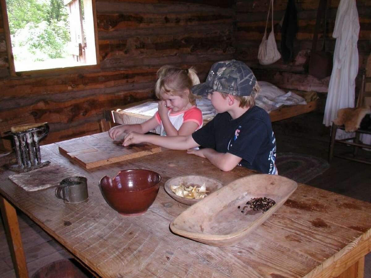 Two of my grandchildren help out at Barrington Living History Farm.