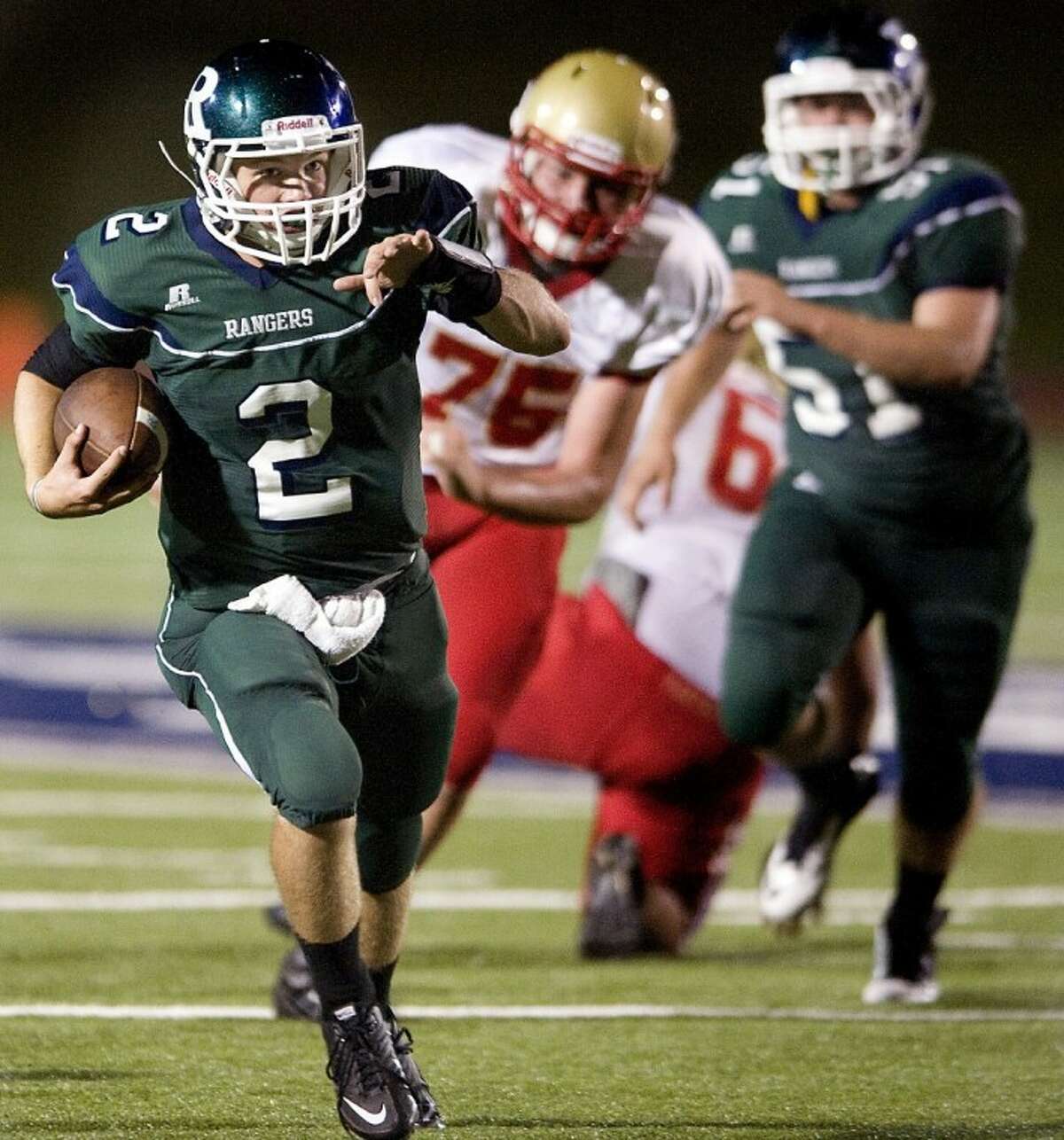 Rudder quarterback Luke Piper runs for a first down on fourth down during the third quarter on Friday.