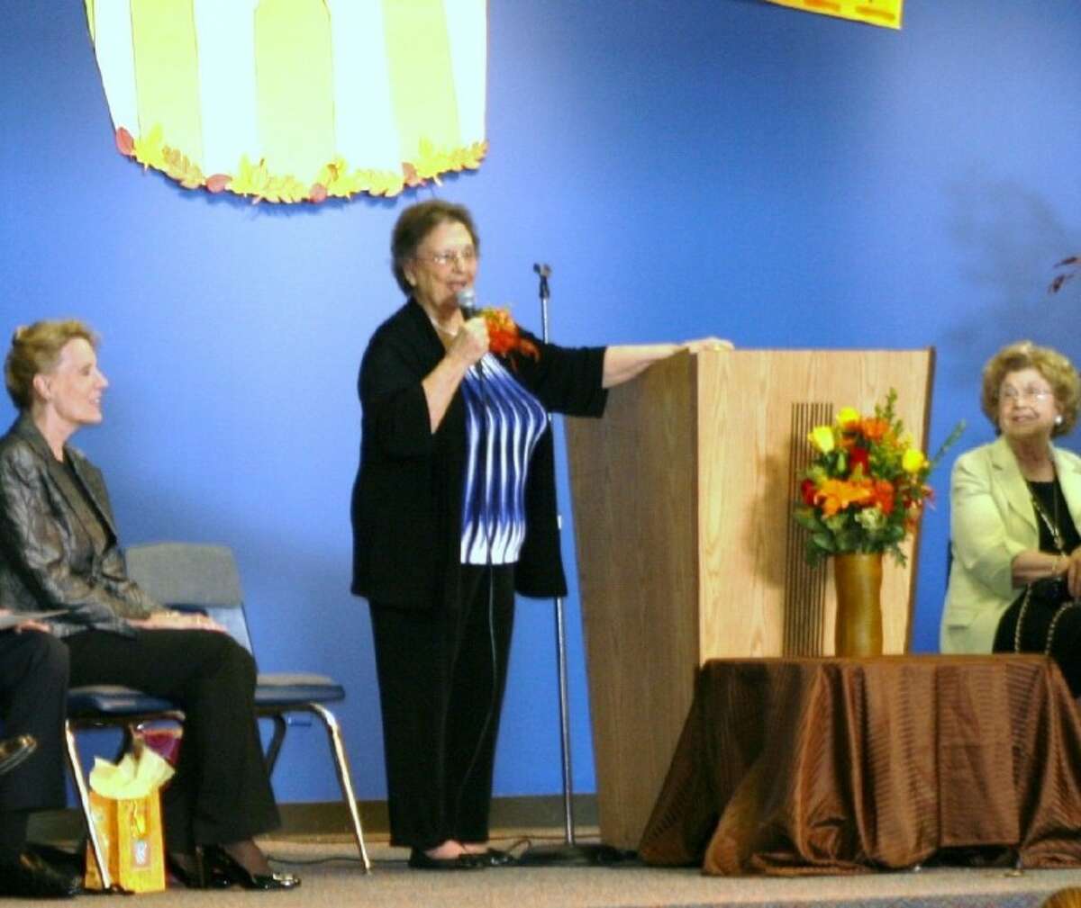 Imogene Giesinger speaks to students during a celebration of her 80th birthday at Giesinger Elementary, which is named after her.