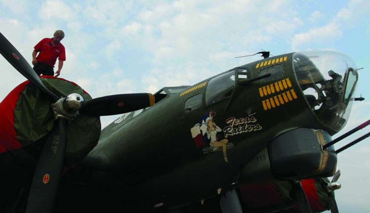 Flight engineer Lee Brown inspects a B-17G Flying Fortress before takeoff at Lone Star Executive Airport Saturday. The historic plane based out of Tomball is available for tours and rides today from 10 a.m.-1:30 p.m. Rides range in price from $425-$625 per person depending on seat location and are offered at 3 p.m, 4 p.m. and 5 p.m. Tours are $5 for adults, $3 for children and World War II veterans and active duty military members are free.