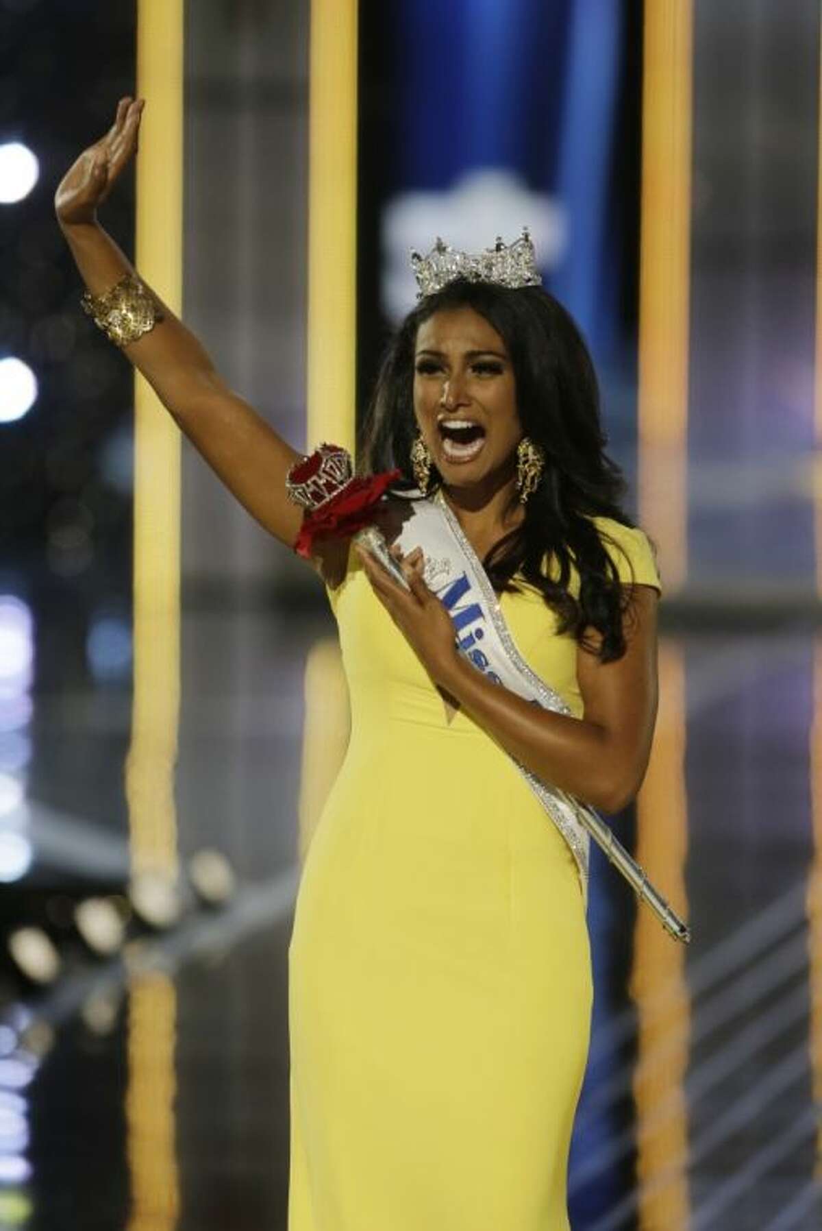 Miss New York Nina Davuluri walks down the runway after winning the the Miss America 2014 pageant, Sunday, Sept. 15, 2013, in Atlantic City, N.J.