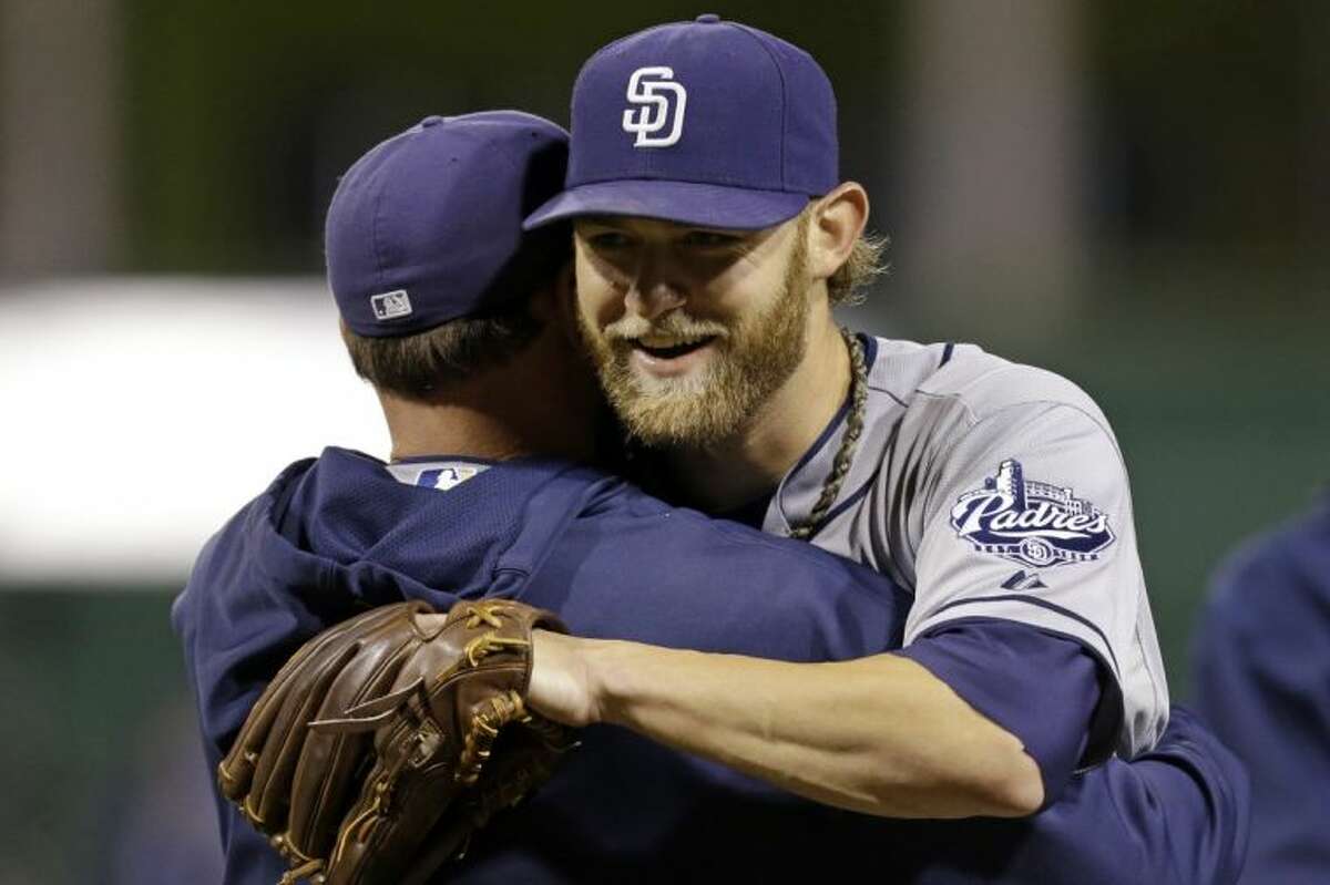 Padres pitcher Andrew Cashner, a former Conroe High School standout, is congratulated after throwing a 1-hitter against the Pirates.