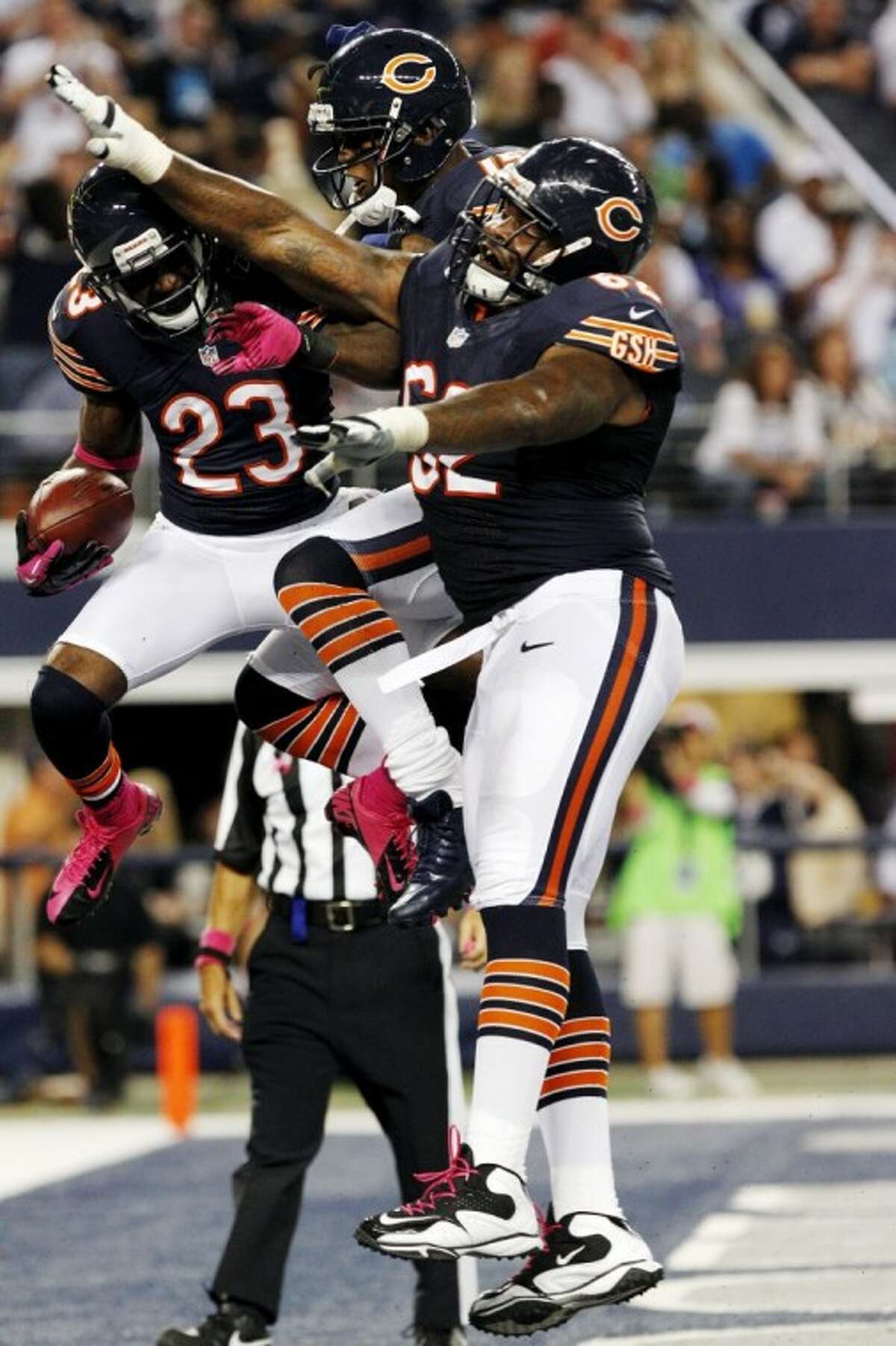 Cbicago Bears wide receiver Devin Hester (23) celebrates his touchdown against the Dallas Cowboys with Brandon Marshall (15) and Chilo Rachal.