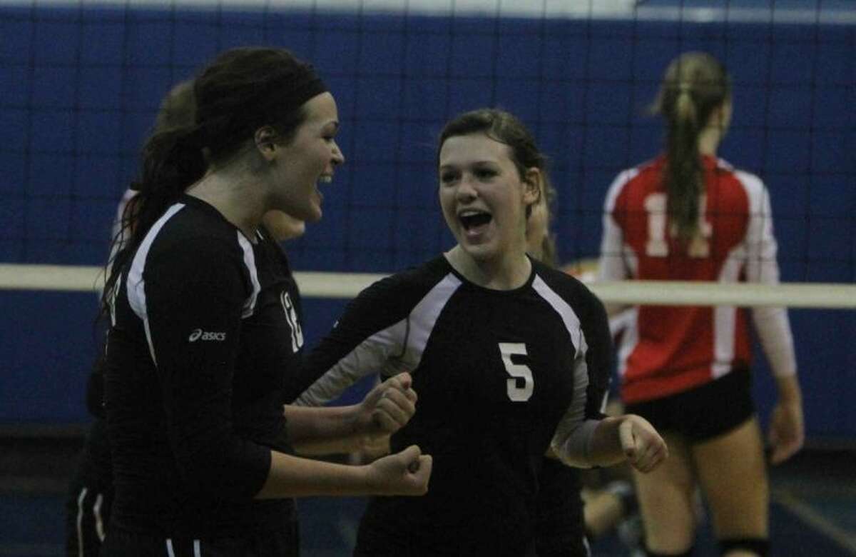 Covenant Christian’s Hannah Ramey celebrates with Alayna Holm after beating Incarnate Word on Tuesday at Covenant Christian School. To view or purchase this photo and others like it, visit HCNpics.com.