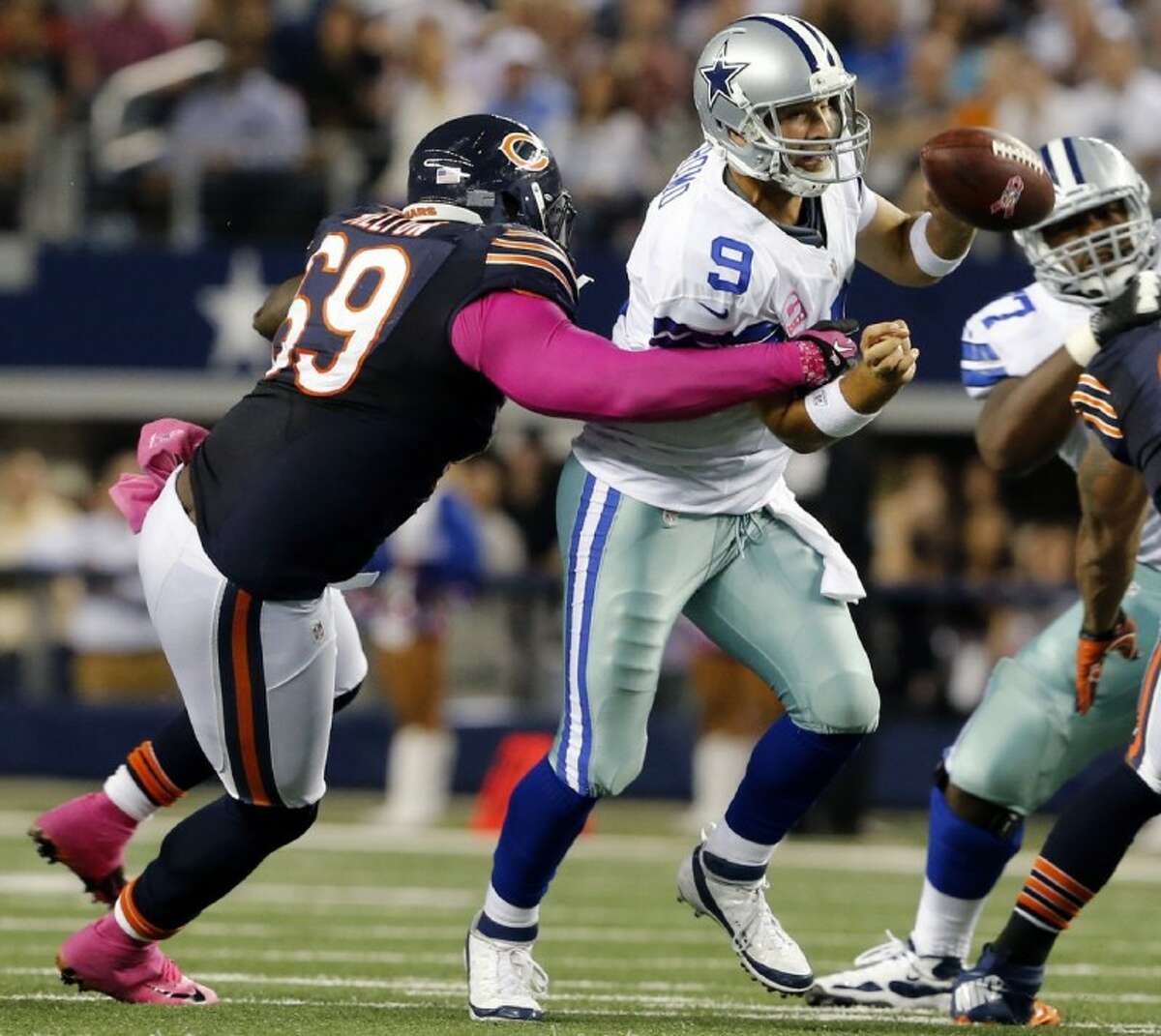 Chicago Bears defensive lineman Henry Melton sacks Cowboys quarterback Tony Romo. The Bears whipped the Cowboys 34-18.