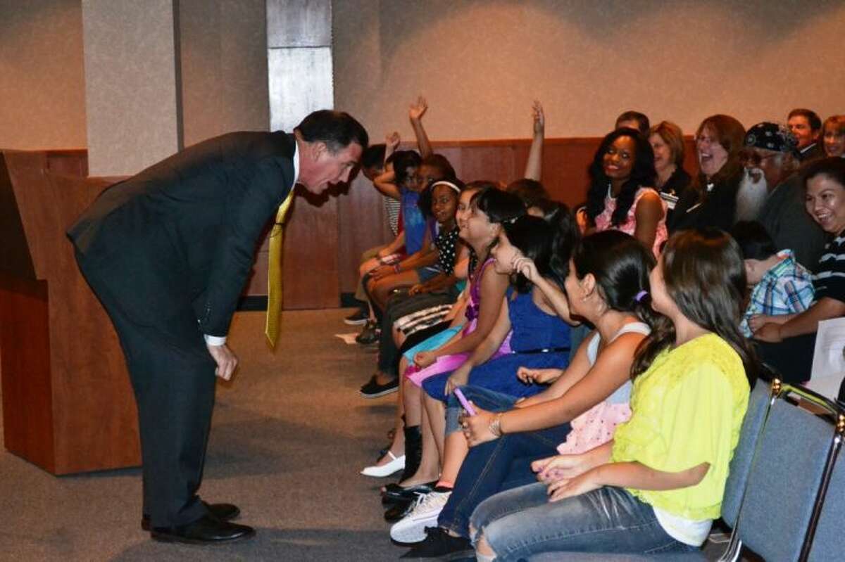 Conroe ISD Superintendent Dr. Don Stockton talks to Ashley Cross’ third grade class, of Armstrong Elementary, during Tuesday night’s Board of Trustees meeting.