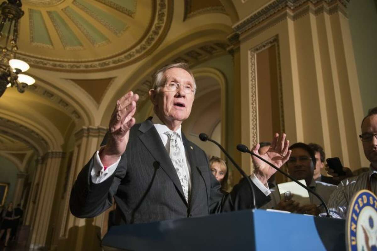 Senate Majority Leader Harry Reid, D-Nev., speaks to reporters following a Democratic caucus at the Capitol in Washington, Tuesday.