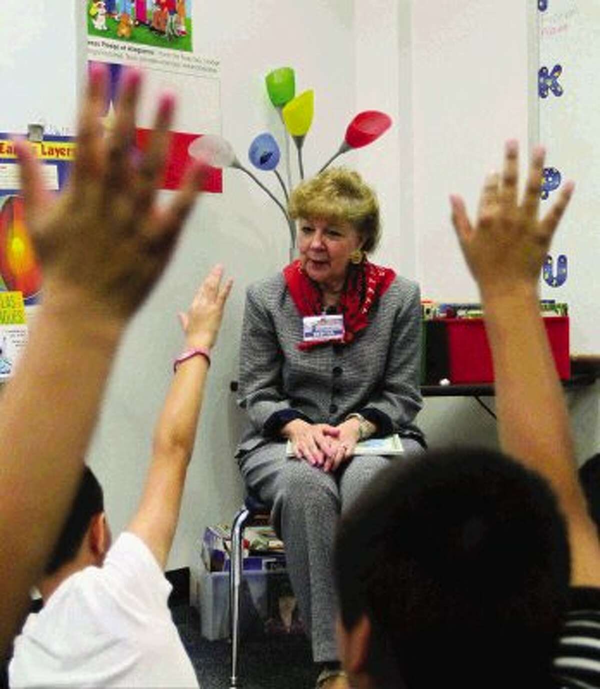 State District Judge Kathleen Hamilton asks a questions to Reaves Elementary fourth graders at as part of Conroe ISD's "Read for a Better Life" program Wednesday. The program's goal is for adults within the Conroe ISD community to commit to reading to every students for thirty minutes each day.