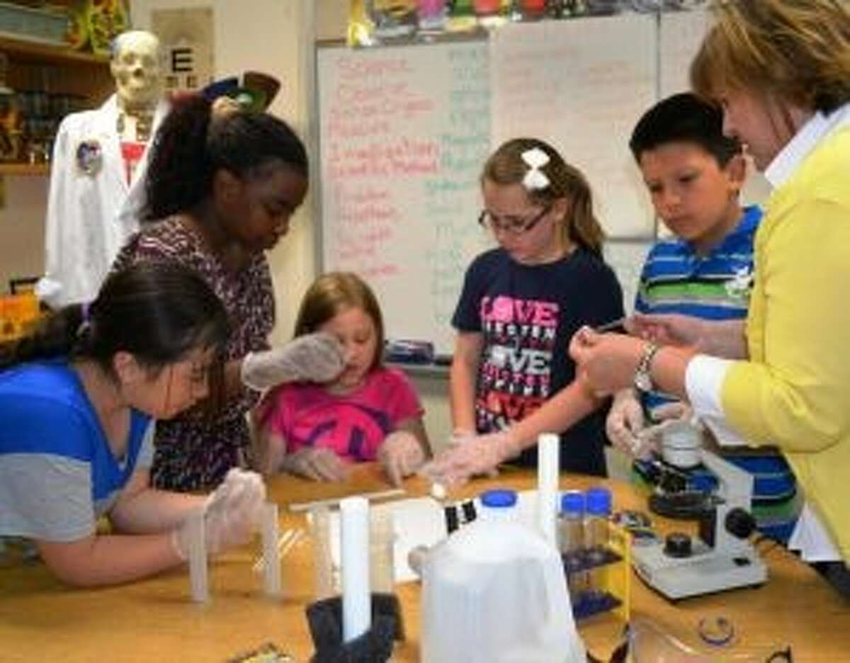 Willis ISD students worked on their science experiment in this April file photo. The experiment is bound for the International Space Station after launching in Wallops Island, Va. Wednesday.