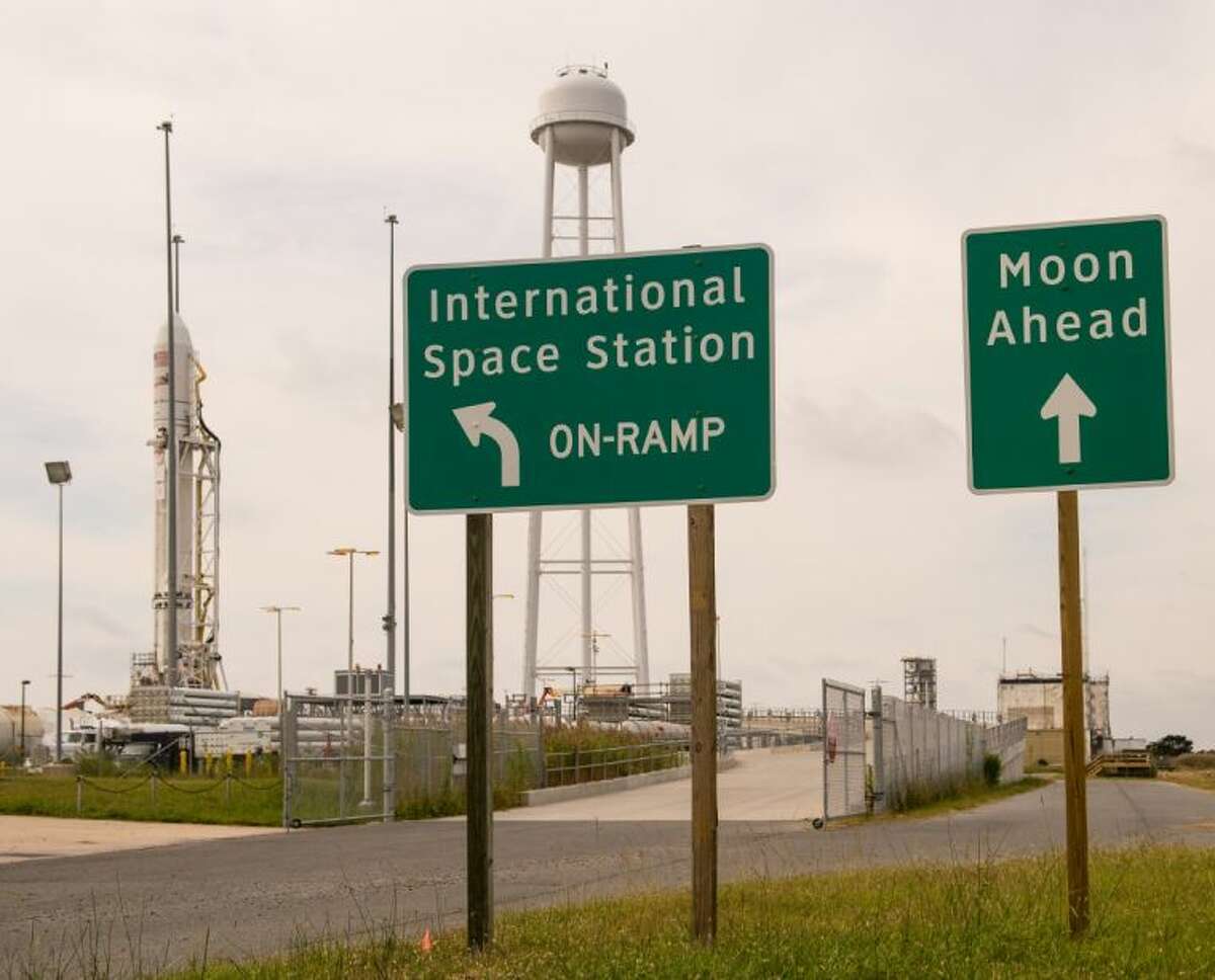 Signs posted outside launch Pad-OA are seen as the Orbital Sciences Corporation Antares rocket, with its Cygnus cargo spacecraft aboard, is visible on the Mid-Atlantic Regional Spaceport (MARS) at the NASA Wallops Flight Facility.