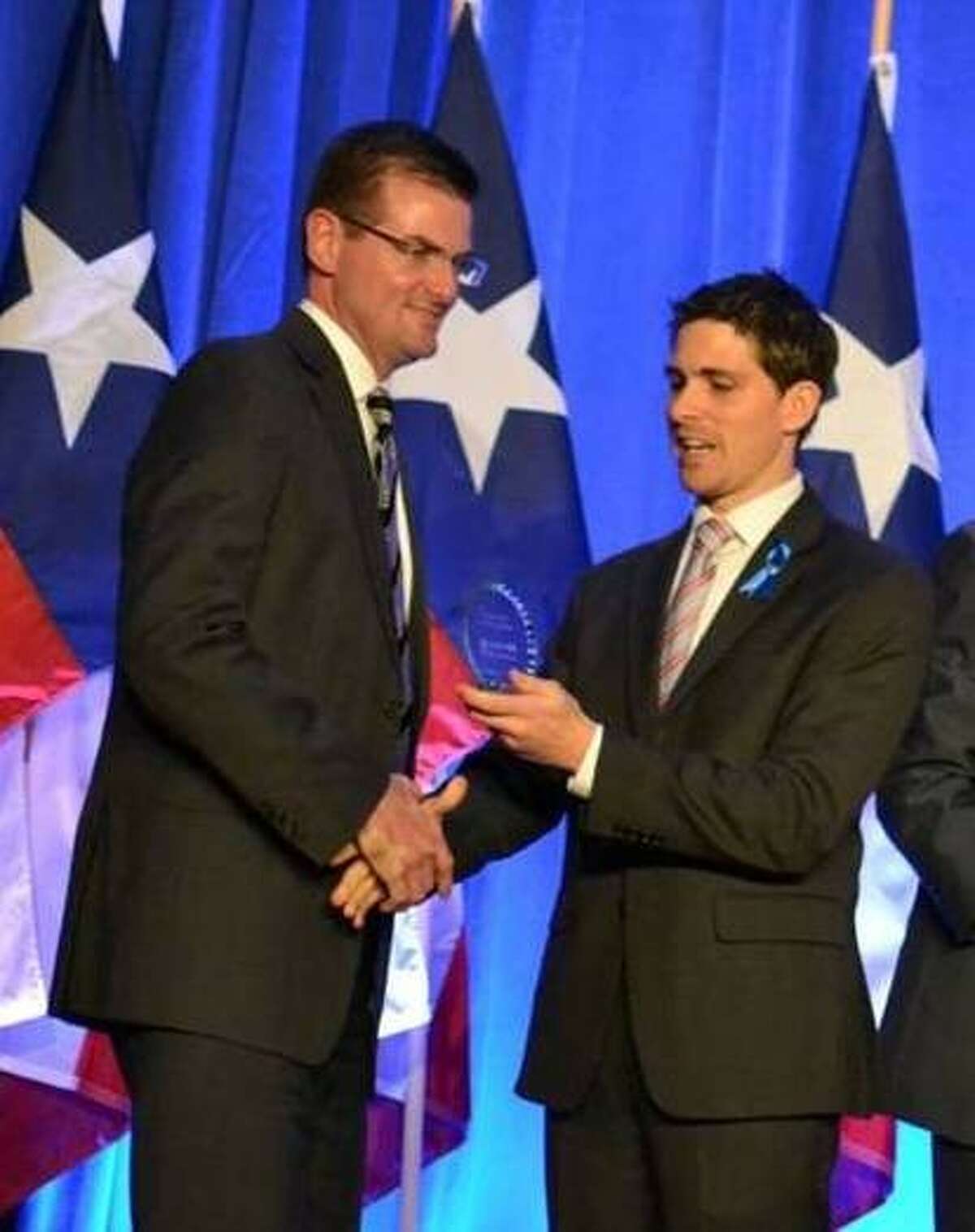 House District 16 Representative Brandon Creighton (left) receives recognition Friday night at the Texas Right For Life 16th Annual Celebration House.
