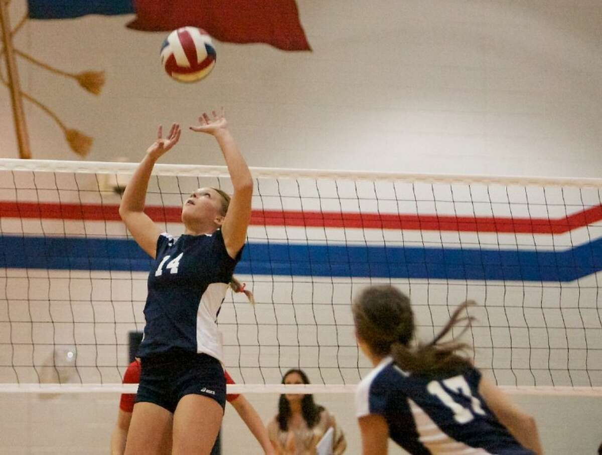 College Park’s Andi Platt sets the ball during Friday night’s district game against Oak Ridge. To purchase or view this photo and others like it, visit: www.yourconroenews.com/photos