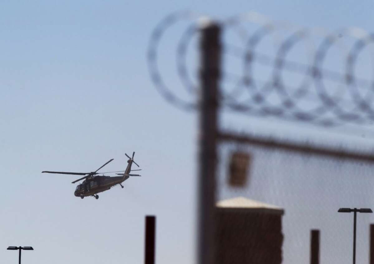 A helicopter believed to be carrying Homeland Security Secretary Janet Napolitano takes off from the Brian A. Terry Border Patrol Station outside in Bisbee, Ariz. on Friday. A preliminary investigation has found friendly fire likely was to blame in the shootings of two border agents along the Arizona-Mexico border, the FBI said Friday.