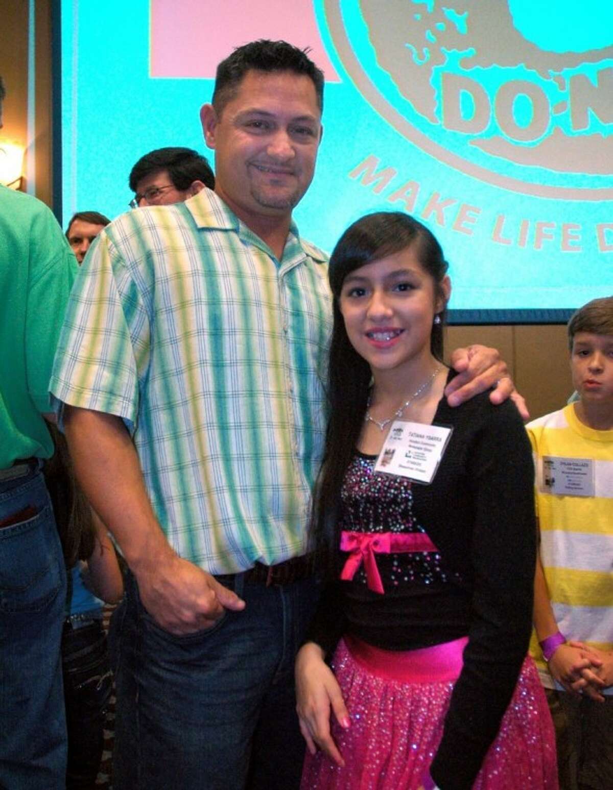 Joey Ybarra and daughter Tatiana waiting to receive HCN’s $50,000 scholarship award.