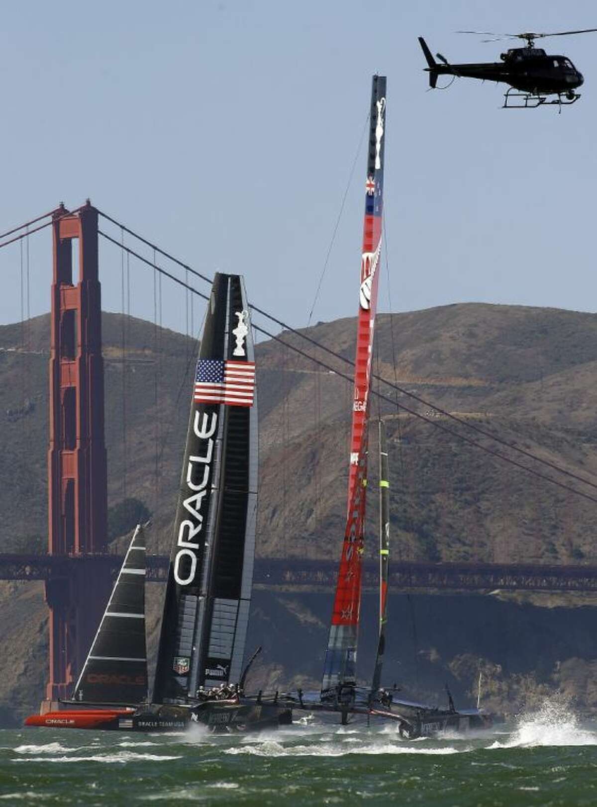 Oracle Team USA competes against Emirates Team New Zealand in the 19th race of the America’s Cup on Wednesday in San Francisco.