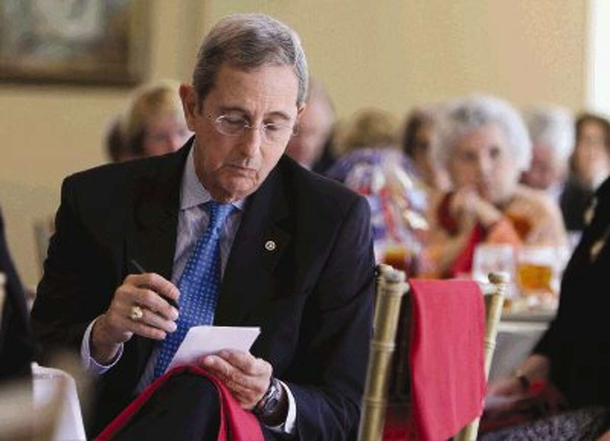 Texas Land Commissioner Jerry Patterson, who announced his candidacy for Lieutenant Governor, makes notes before speaking at the Montgomery County Republican Women's general meeting at the River Planation Country Club Thursday.