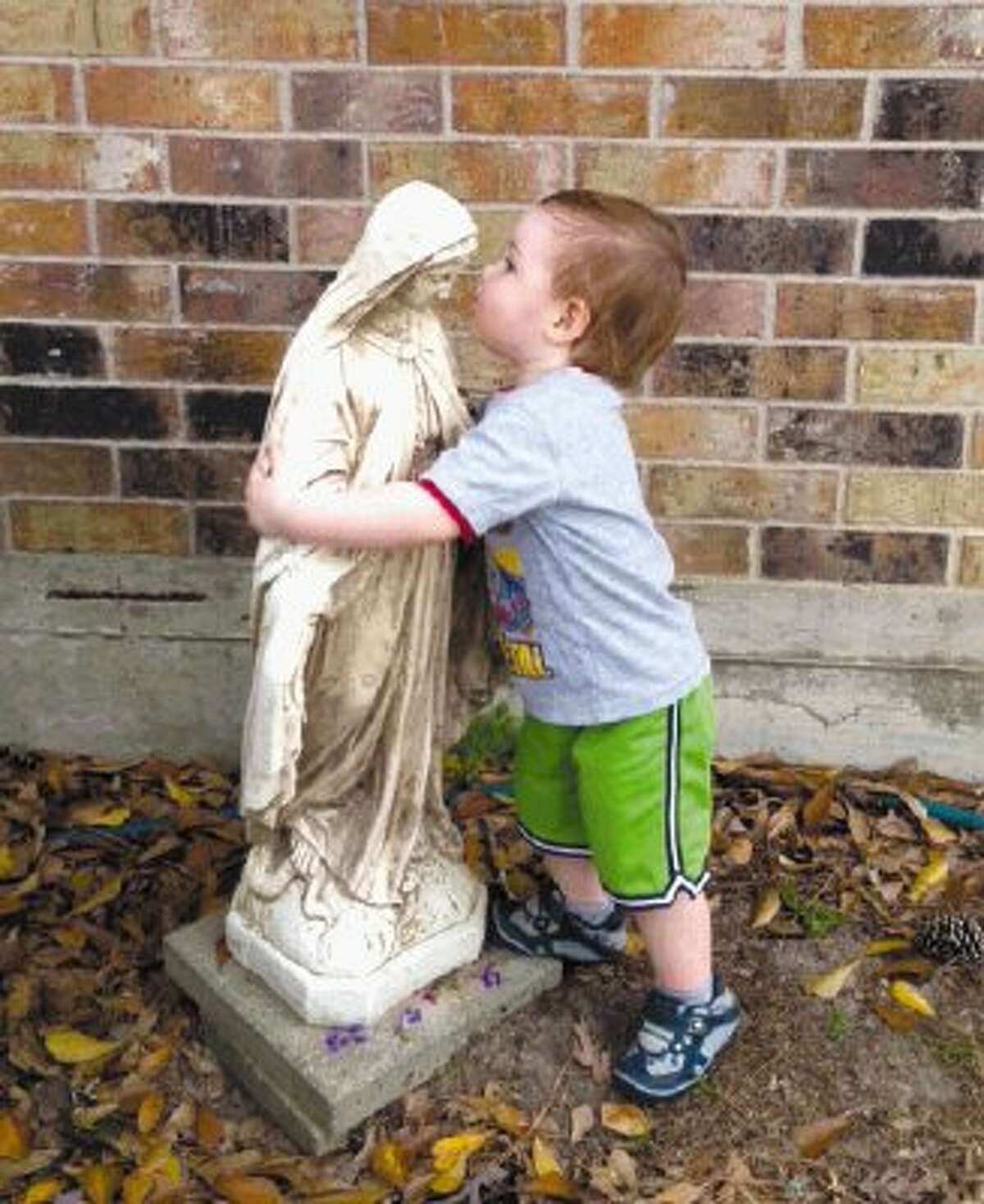 In this archive photo from March 2, 2012, 19-month-old William Barnes, V, gives Mother Mary a hug and a kiss in front of his grandmother’s home in River Plantation. Aunt Liz used her iPhone to capture the special moment.
