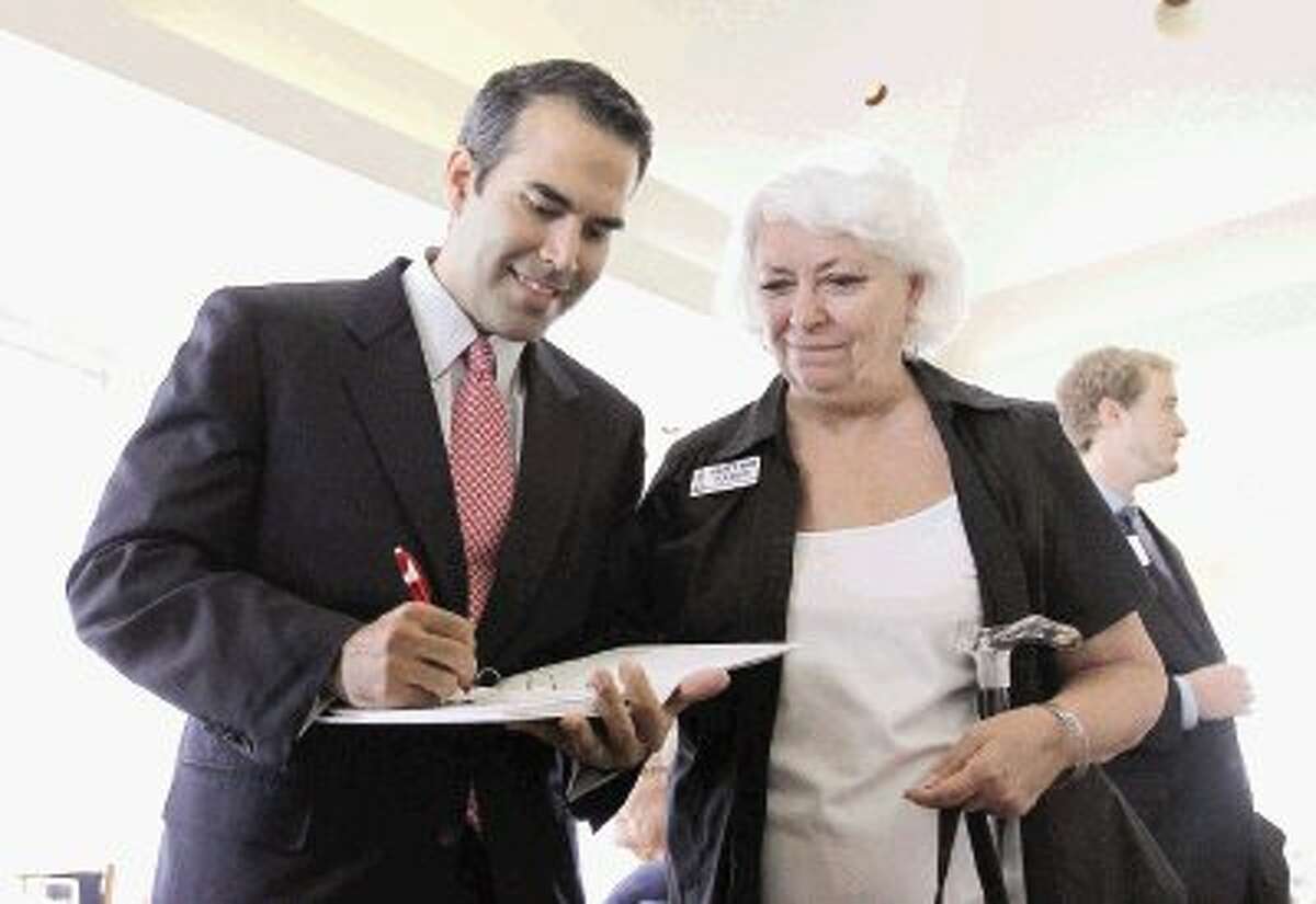 George P. Bush, nephew of former President George W. Bush, signs an autograph for Betty Ann Tolbert after speaking at the North Shore Republican Women’s meeting at Bentwater Yacht Club Wednesday. Bush is a candidate for Texas general land commissioner in 2014. Go to HCNPics.com to view more photos from Bush's visit.