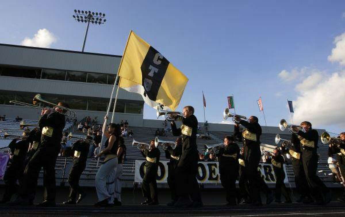 The Conroe High School Tiger Band marches around Moorhead Stadium prior to the start of last Friday’s football game against Nimitz. The band has been invited to perform in services at the White House in Washington, D.C., and in New York City in 2011 to mark the 10th anniversary of the terrorist attacks that killed nearly 3,000 people. To purchase this photo or others like it, visit: http://hcnonline.mycapture.com