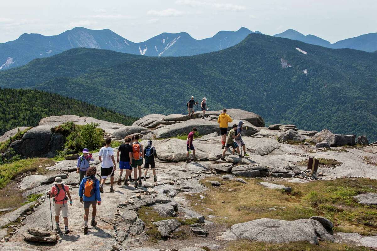 Hikers stand on the summit of Cascade Mountain on July 20, 2016. (Nancie Battaglia/Special to the Times Union)