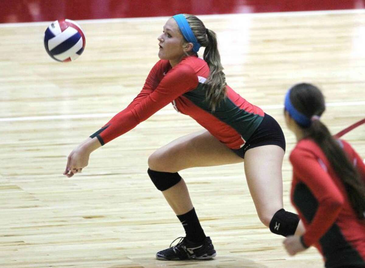 The Woodlands' Madison McDaniel (3) goes for a dig during a Class 5A UIL Volleyball State Championship semifinal game in Garland, Texas, Friday. The Woodlands defeated Clear Falls 3-1. To purchase this photos and others like it, go to HCNPics.com