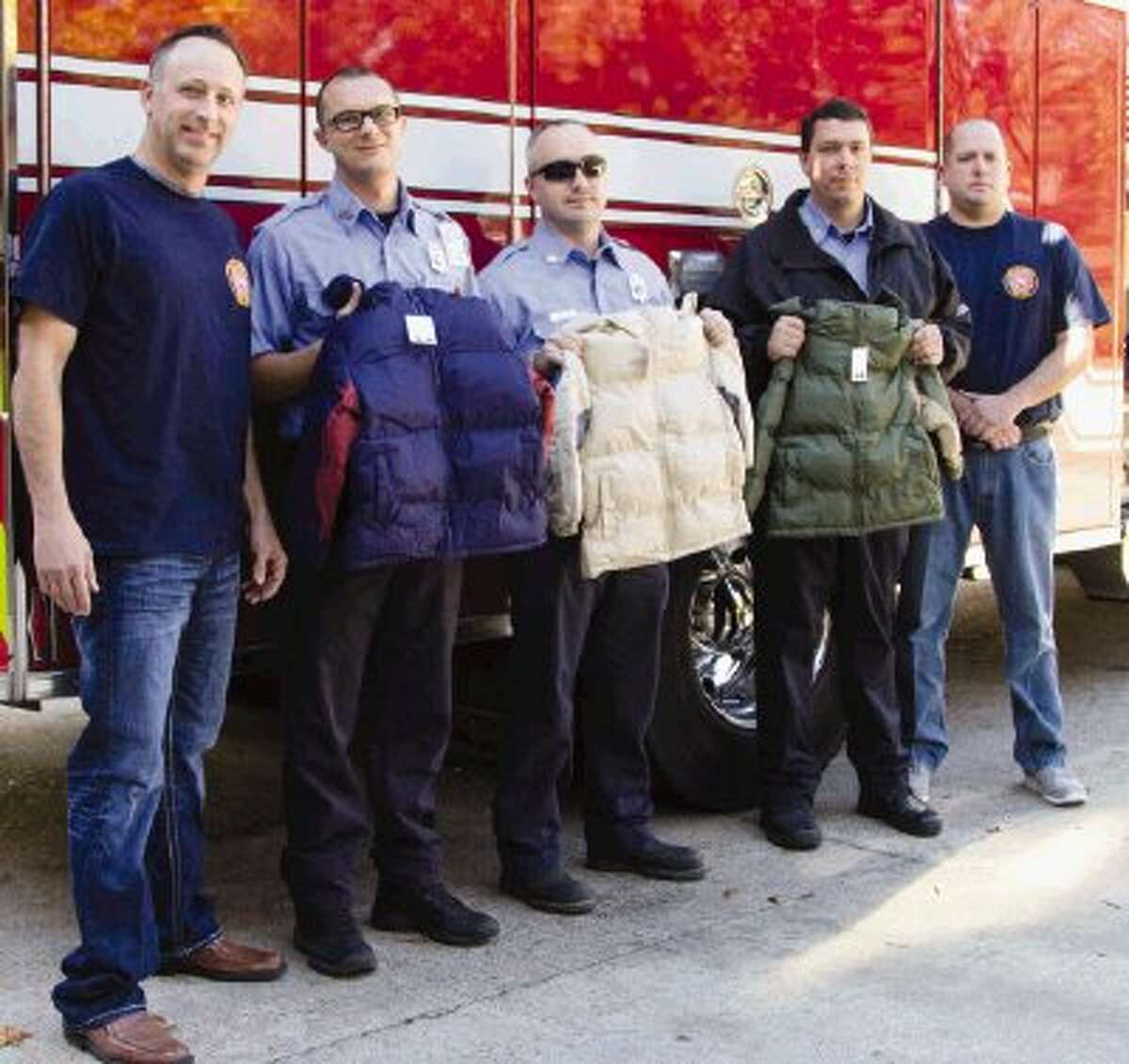 Lt. Lloyd Sandefer, Joseph Maddox, Sean Semora, Cory Neitzel and Bobby Allen, of Conroe Fire Station 3, prepare to leave the station to distribute about 25 winter coats to students from Milam Elementary School in Conroe Monday. This is the station’s first year participating in the Coats for Kids Foundation. Firefighters from all over the United States and Canada partake in the event.