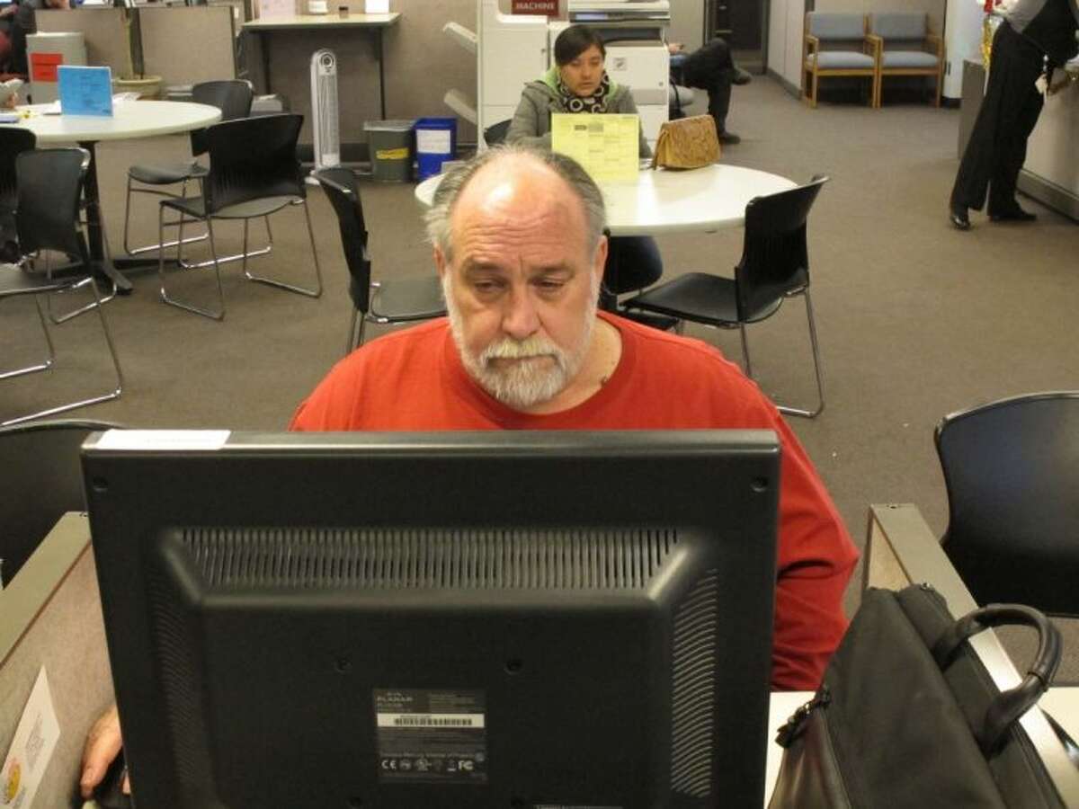 Richard Mattos, 59, looks for jobs at a state-run employment center in Salem, Ore., on Thursday. Mattos is one of more than 1 million Americans who will lose federal unemployment benefits at year’s end.