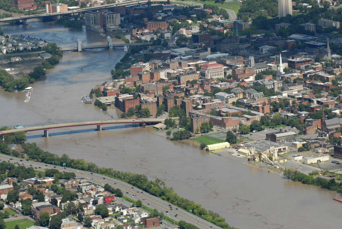 Aerial view of the Hudson River in Troy showing flooding following Tropical Storm Irene in 2011. Climate change is a threat to history in more way than one, say historians contributing to an upcoming state study. (Will Waldron/Times Union)