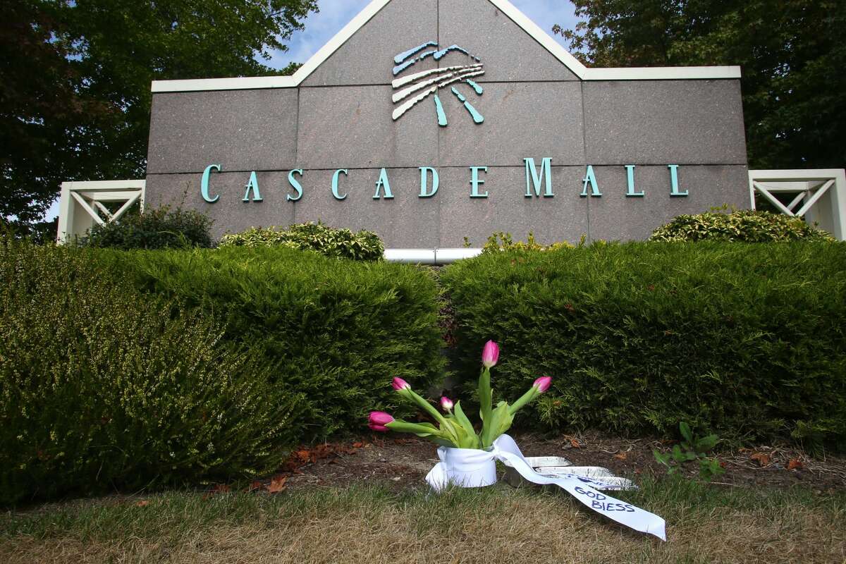 BURLINGTON, WA - SEPTEMBER 24: Flowers were placed in front of an entrance to the Cascade Mall on September 24, 2016 in Burlington, Washington. Five people were killed last night when a gunman opened fire in the shopping mall. (Photo by Karen Ducey/Getty Images)