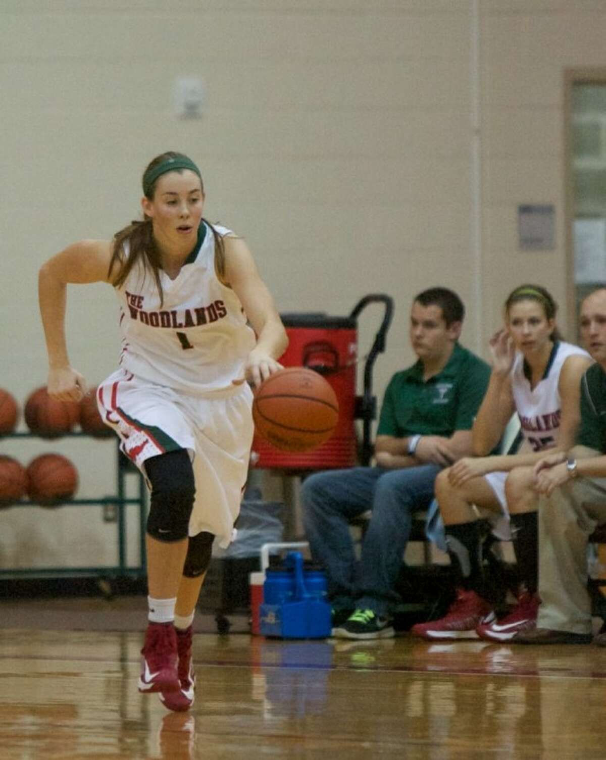 The Woodlands’ Nicole Iademarco dribbles downcourt during a game last season.