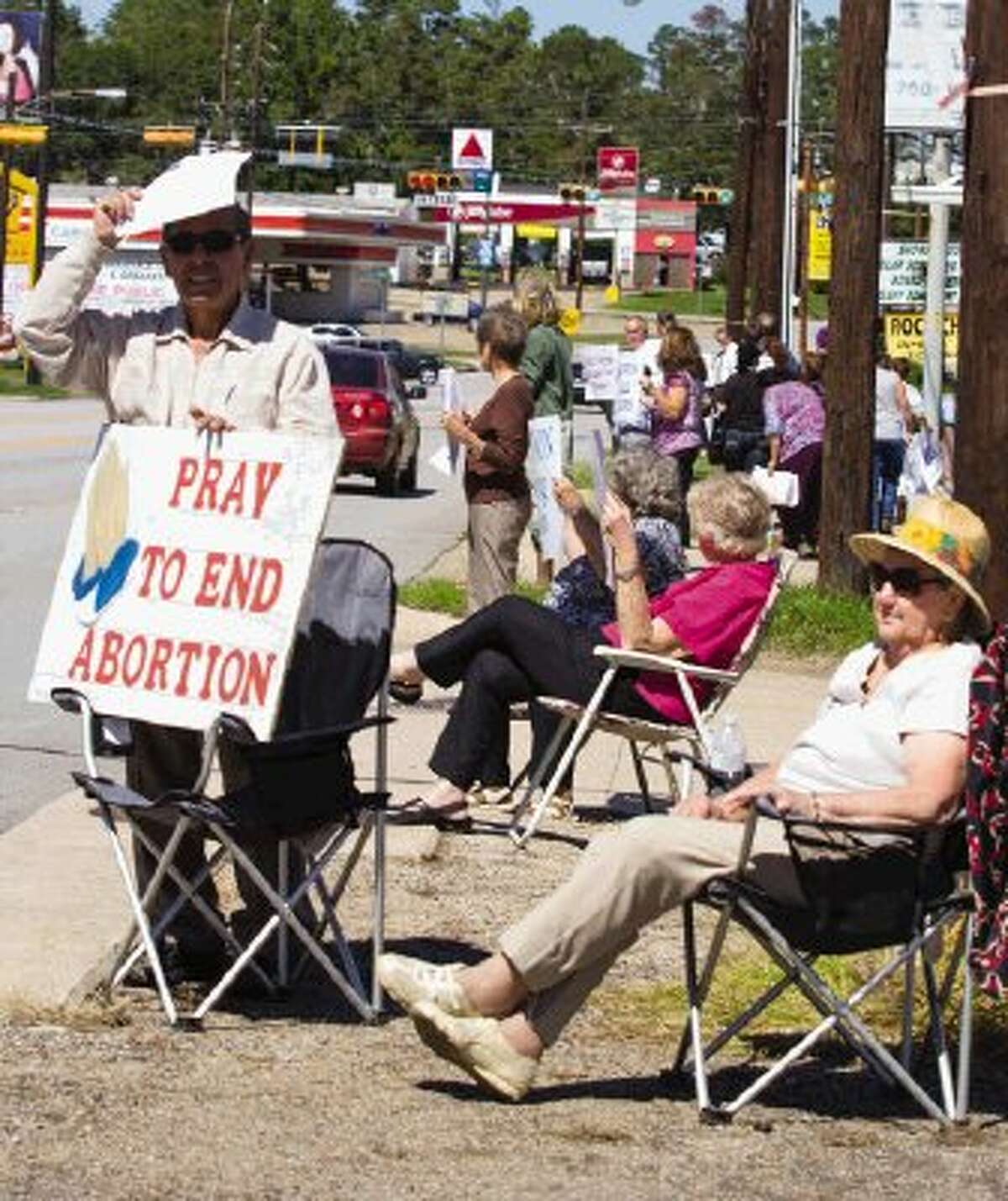 Pro-life supporters hold up signs during the Life Chain, a pro-life movement, Sunday afternoon. People lined Frazier Street in Conroe holding up pro-life signs. Go to HCNPics.com to view and purchase this photo, and others like it.