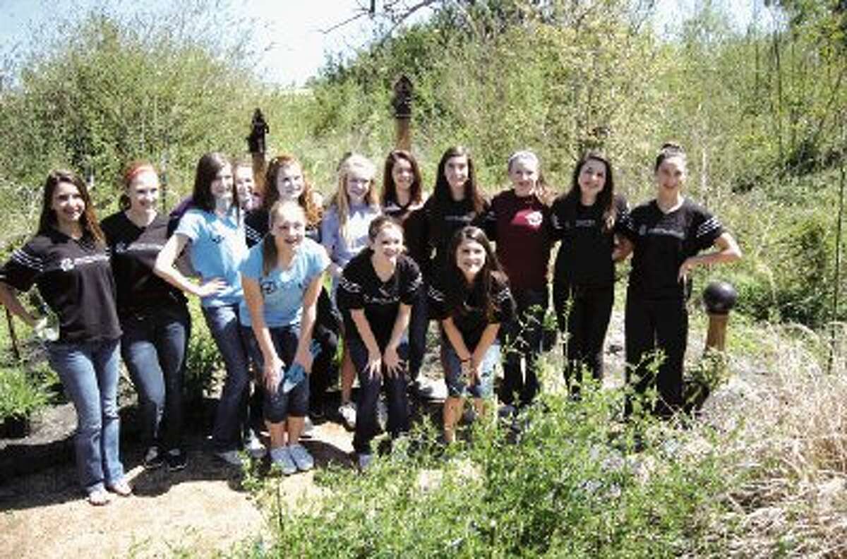 Eighth Grade girls from the Montgomery Chapter of The National Charity League spent Sunday, March 24 at Memory Park, planting lots of new flowers in The Rainbow Bridge Garden.