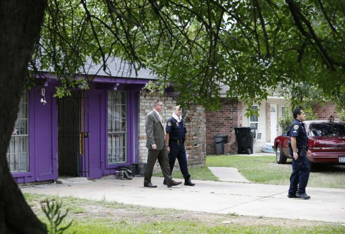 Authorities investigate a home Friday in Houston where police say four homeless men were found in deplorable conditions. Officers who responded to a call expressing concern said they found three men locked in a garage and a fourth in the home who were malnourished and may have been being held so a captor could cash checks the men were receiving. One person was taken into custody.