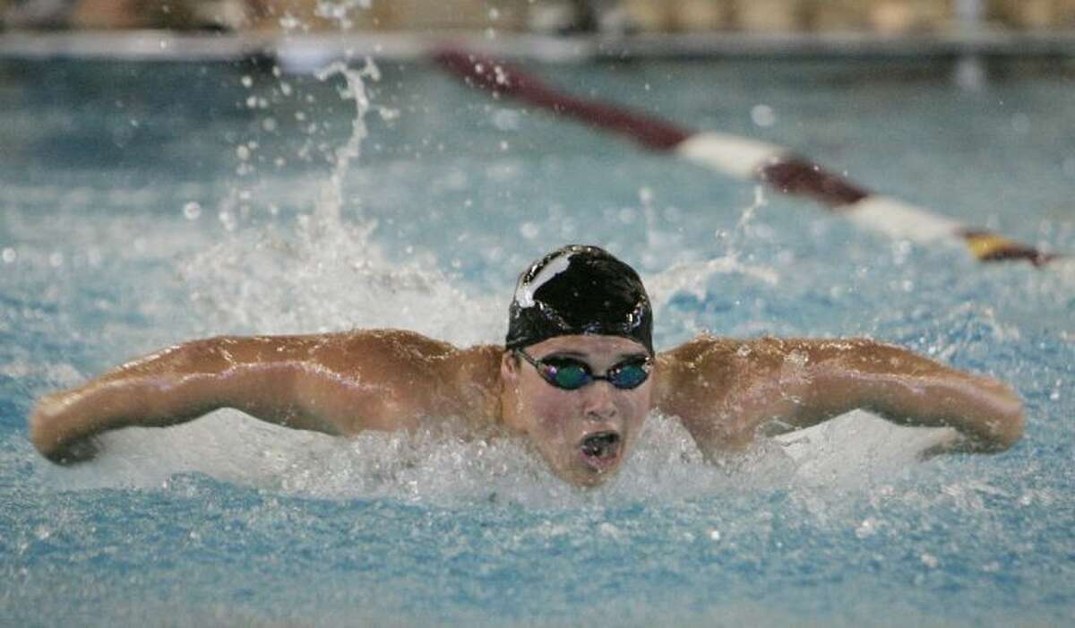 Willis’s Will Waidhoffer competes in the 100-yard butterfly during Friday’s prelims of the Region V-4A Swimming and Diving Championships at the Michael D. Holland Aquatic Center in Magnolia. To view or purchase this photo and others like it, visit HCNpics.com.