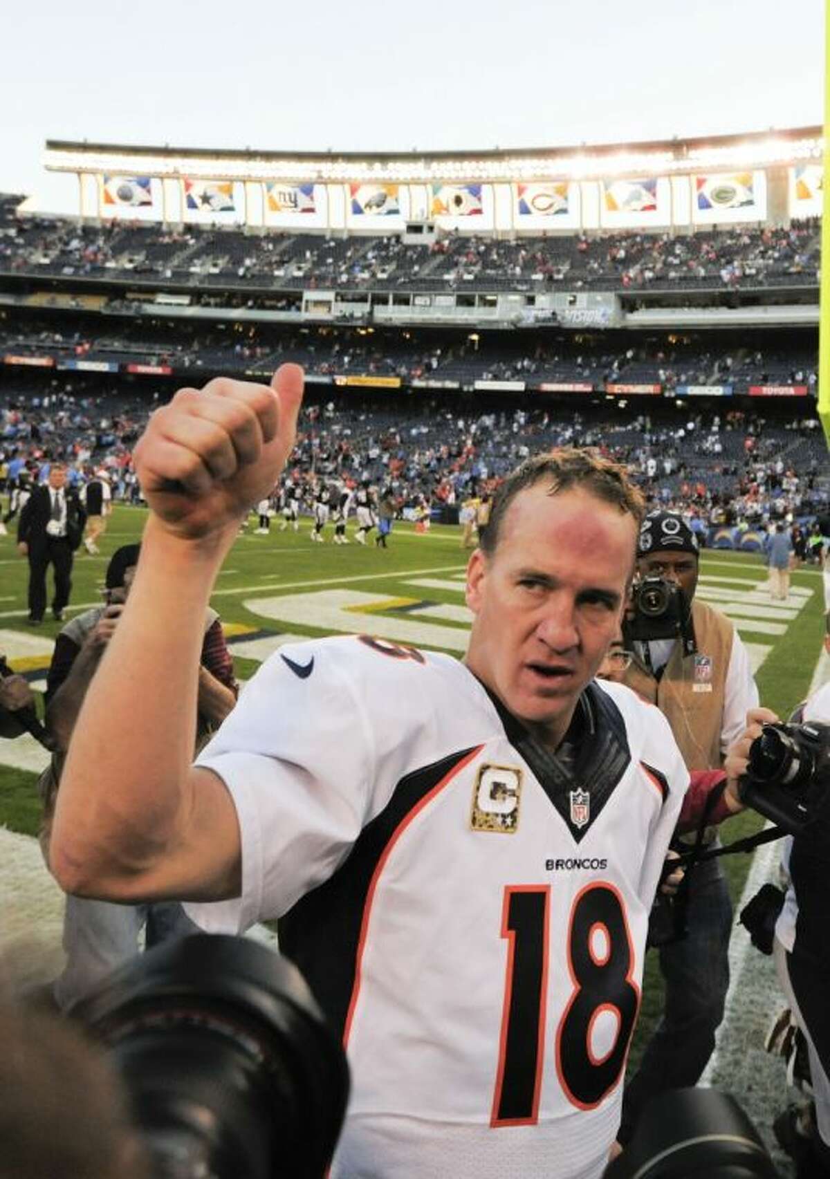 Denver Broncos quarterback Peyton Manning (18) pumps his fist after an NFL football game against the San Diego Chargers Sunday in San Diego. The Broncos won 28-20.
