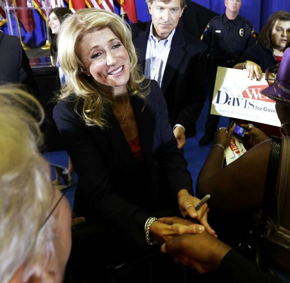 Sen. Wendy Davis, D-Fort Worth, shakes hands with a supporter after a rally Thursday in Haltom City. Davis formally announced her campaign to run for Texas governor.