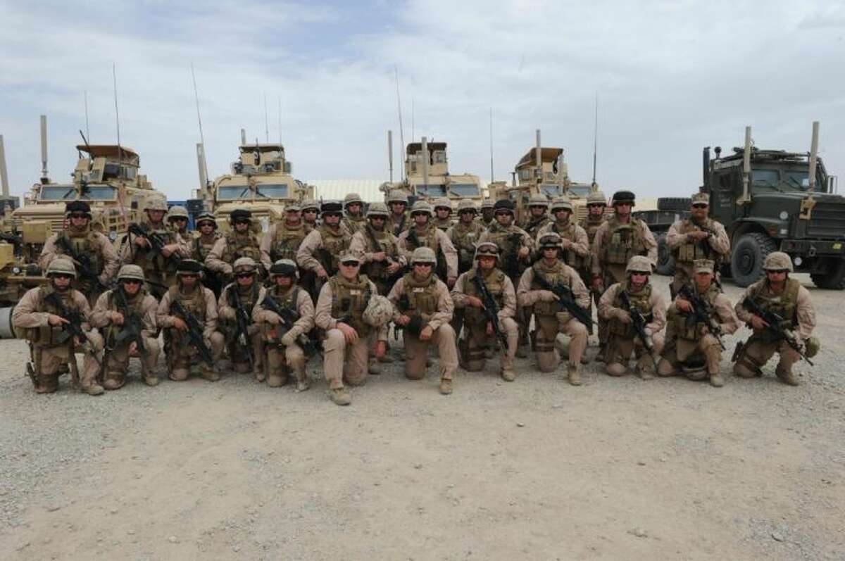 Members of Naval Mobile Construction Battalion 15 pose while serving in Afghanistan. The unit of 500 service members will be receiving individual care packages in the coming weeks, courtesy of The WoodsEdge Armor of God Military Ministry. The group is reaching out to the general public for donations to ensure that every man and woman in the unit receives a care package with items such as snacks, microwaveable meals, socks and towels among others.