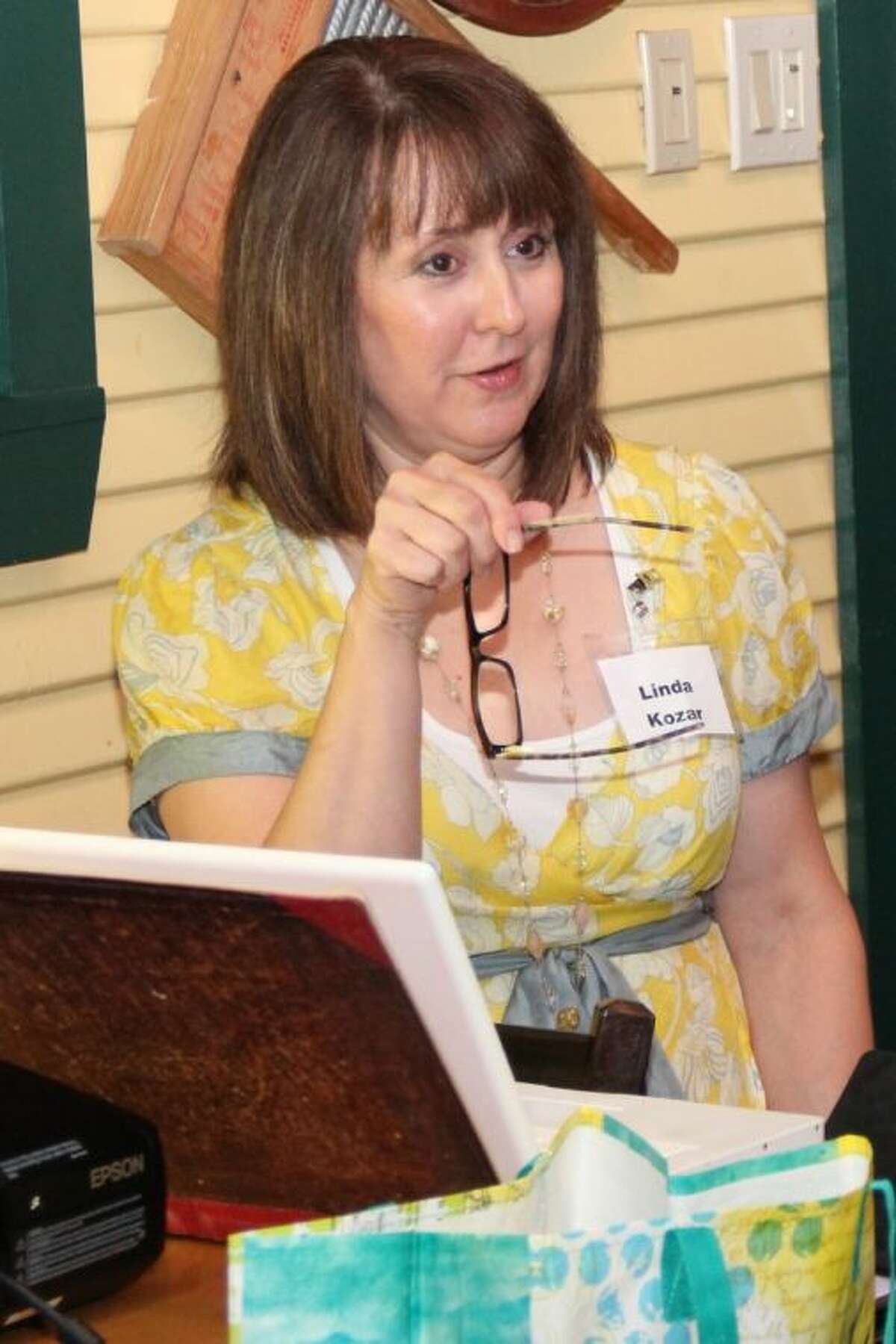 Author Linda Kozar, of The Woodlands teaches other local writers “50 Ways to Say Yellow” during the July meeting of Writers on The Storm, a local chapter of American Christian Fiction Writers.