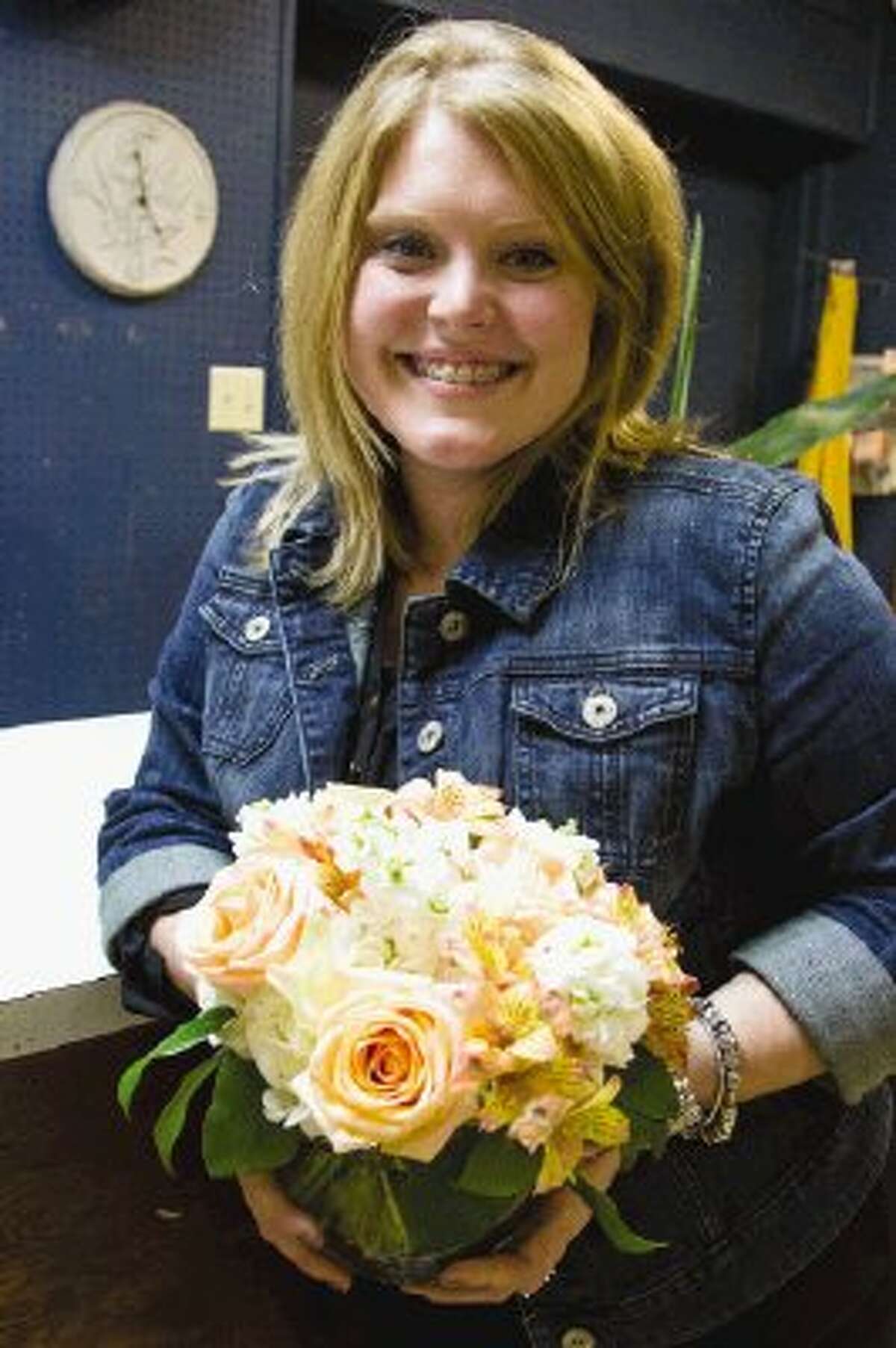 Jessica Carter helps out with her family business, Carterâ€™s Florist, on Tuesday afternoon in Conroe. The business has been family owned and operated for more than 40 years.