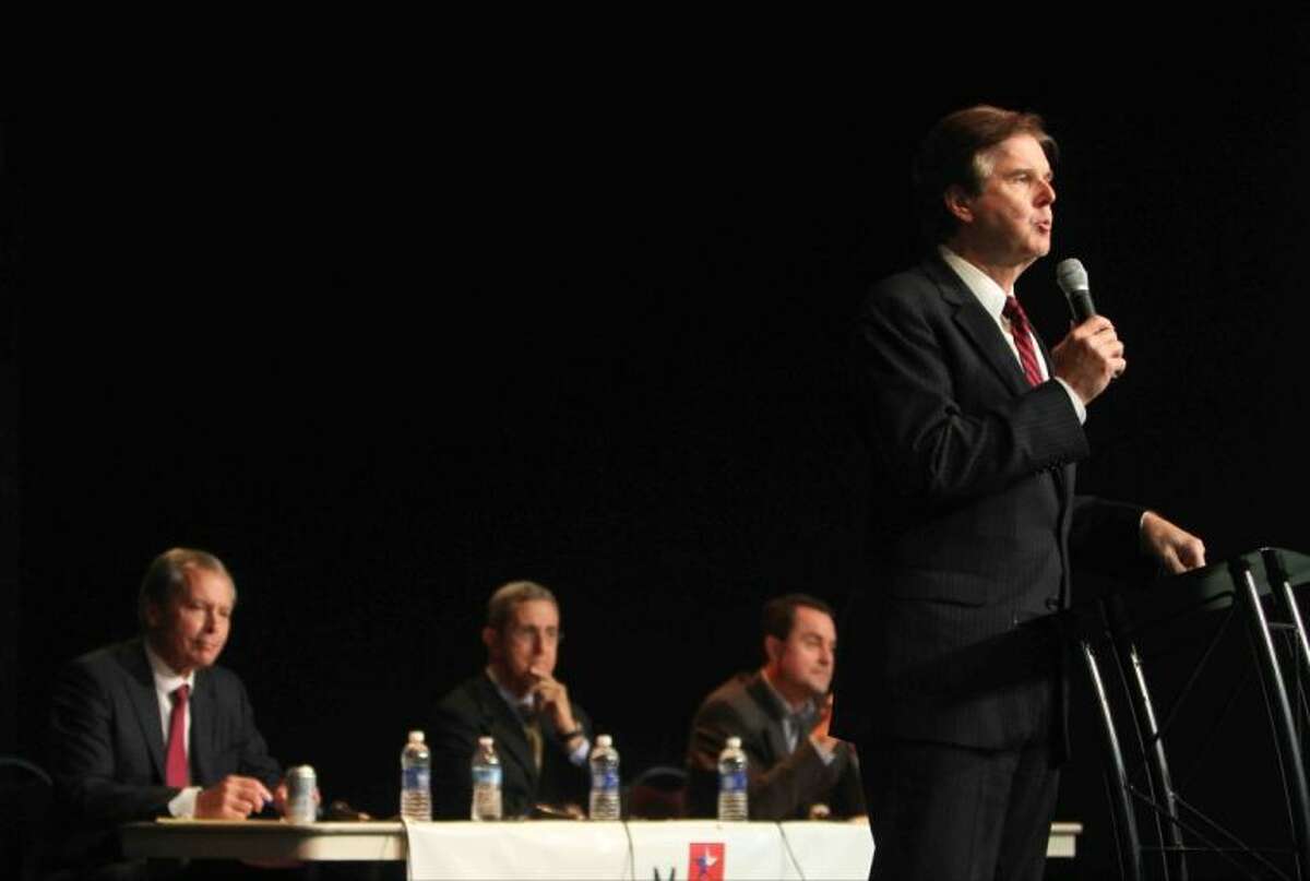 Texas lieutenant governor candidate and Senator Dan Patrick gives his opening address during a statewide Republican Primary debate with fellow candidates David Dewhurst, Jerry Patterson and Todd Staples looks on at First Baptist Church of Conroe Wednesday. Candidates for land commissioner, agriculture commissioner and lieutenant governor attended the debate. Go to HCNPics.com to view more photos from the debate.