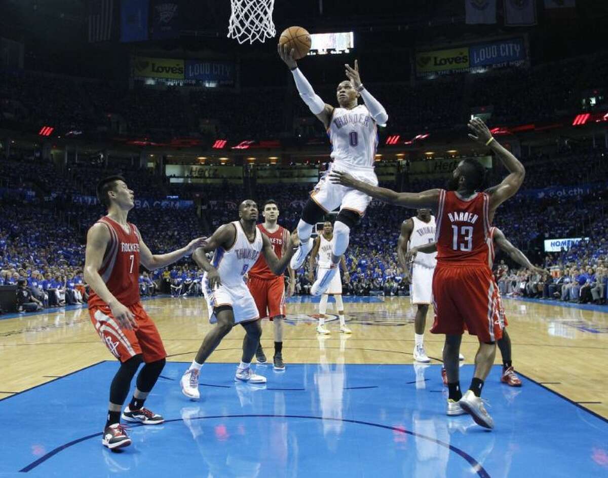 The Houston Rockets’ defense is caught flat footed on Thunder guard Russell Westbrook’s drive to the basket. The Thunder crushed the Rockets 102-91 in Game 1 of their best-of-seven NBA playoff series on Sunday night.