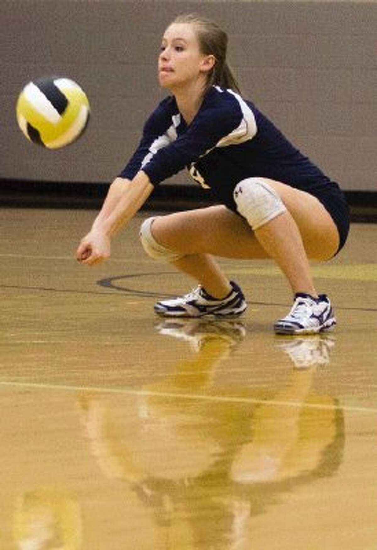 College Park’s Paige Kempker digs the ball against Conroe at Conroe High School on Tuesday night. To view or purchase this photo and others like it, visit HCNpics.com.