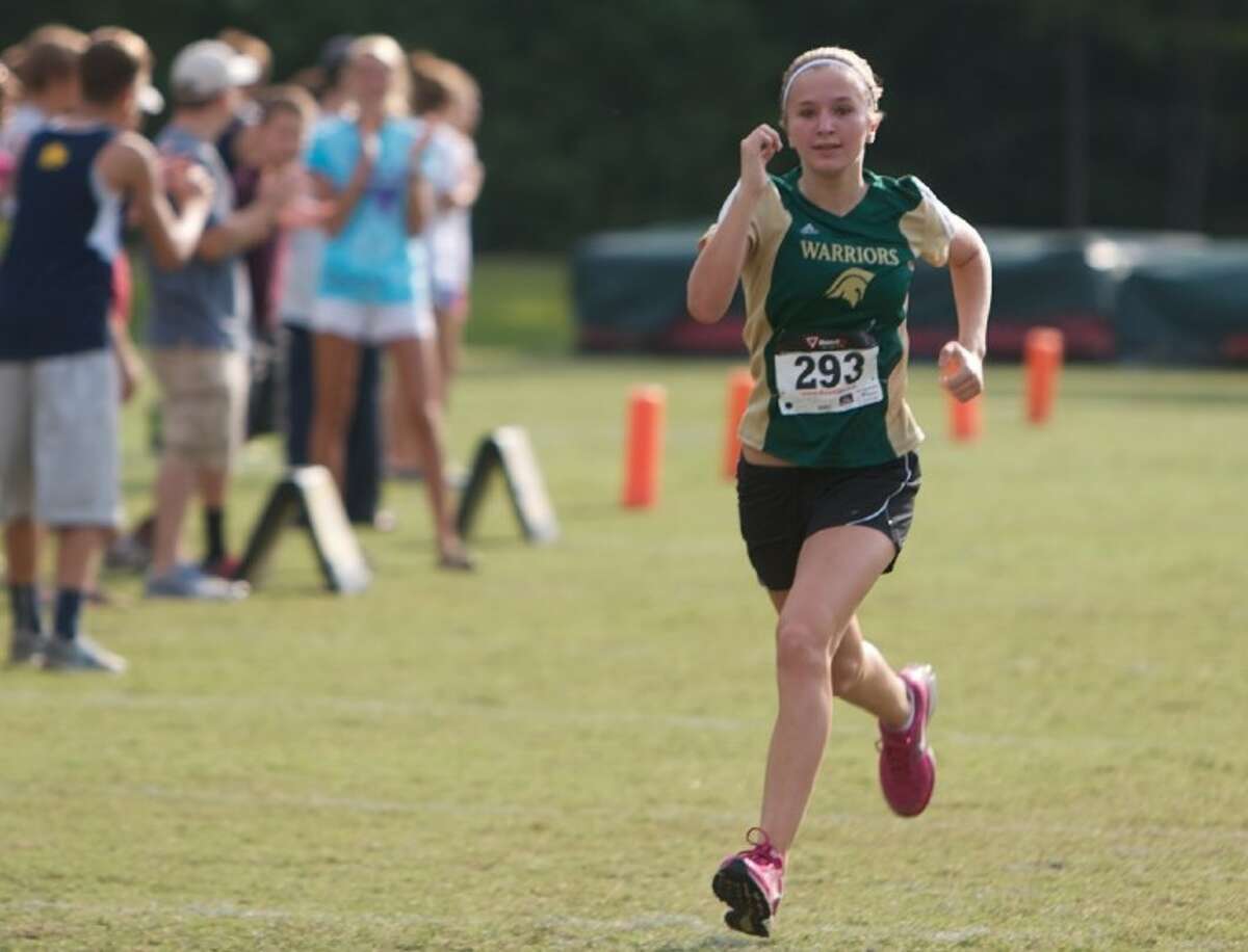 The Woodlands Christian Academy’s Riley Farra, who took seventh individually, pushes toward the finish line in the 3200-meter event during Saturday’s cross country meet held at The Woodlands Christian Academy campus in The Woodlands.