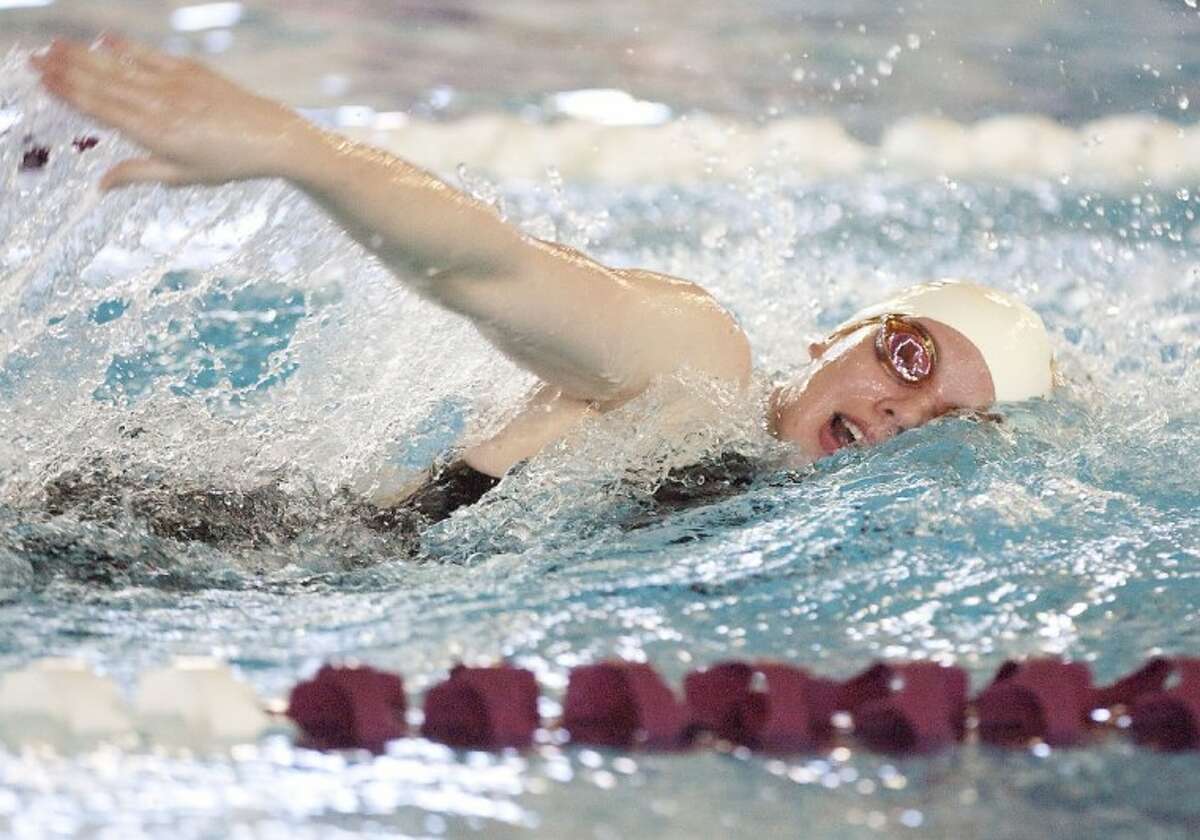 Magnolia West’s Jessica Sloan competes in the 500-Yard Freestyle during the Region Swimming Championships Saturday at the Michael D. Holland Aquatic Center in Magnolia. See more photos online at www.yourconroenews.com/photos.