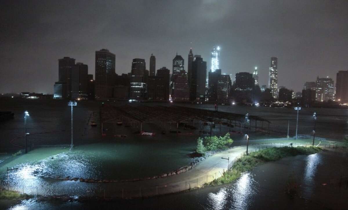 Lower Manhattan goes dark during superstorm Sandy, on Monday, , as seen from the Brooklyn Heights promenade in the Brooklyn borough of New York.