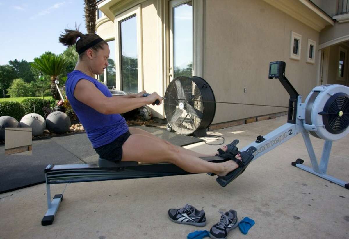 Tayla Correa uses a rowing machine at CrossFit Uproar where she is a trainer.