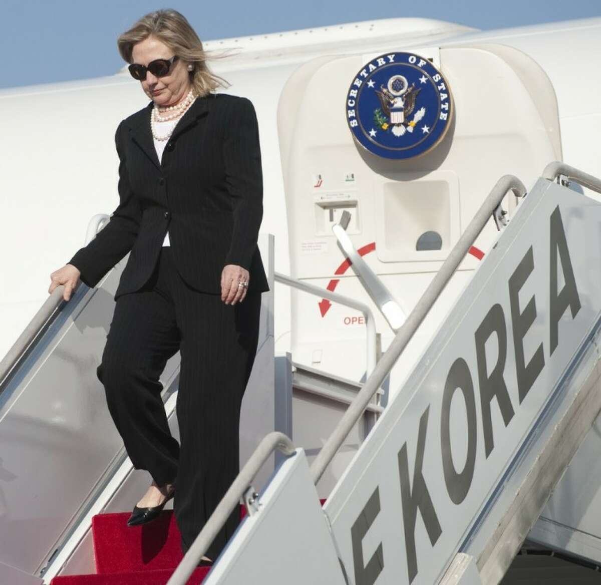 In this April 16, 2011 file photo, U.S. Secretary of State Hillary Rodham Clinton disembarks from a plane upon arrival at Seoul military airport in Seongnam, South Korea. If diplomatic achievements were measured by the number of countries visited, Hillary Rodham Clinton would be the most accomplished secretary of state in history. Since becoming secretary of state in 2009, Clinton has logged 351 days on the road, traveled to 102 countries and flown a whopping 843,839 miles, according to the State Department.
