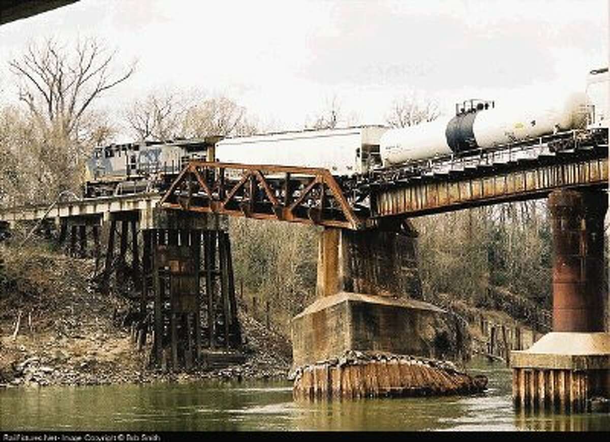 Bob Smith’s photo of a train accident on a Trinity River crossing is an Internet sensation and was used in an episode of the CBS television program “Numbers.”